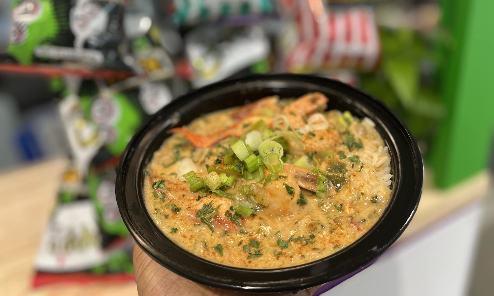 Chef Creole serving a vibrant dish at a New Orleans restaurant